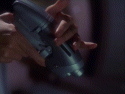 Note correct angle of little finger - perfect phaser-reloading etiquette